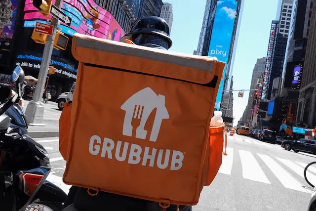 A Grubhub deliver person riding in manhattan